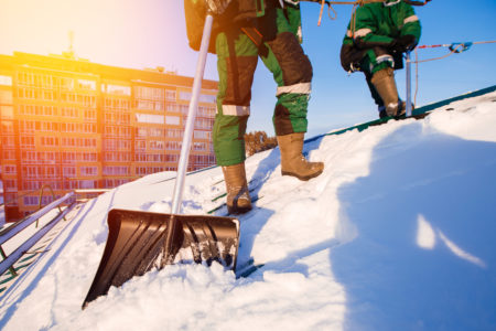 shoveling on a roof